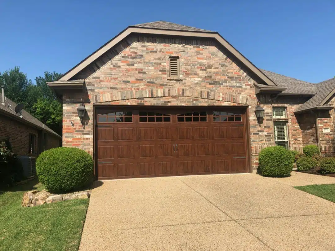 Before and after picture of a broken garage door and after with door fixed.