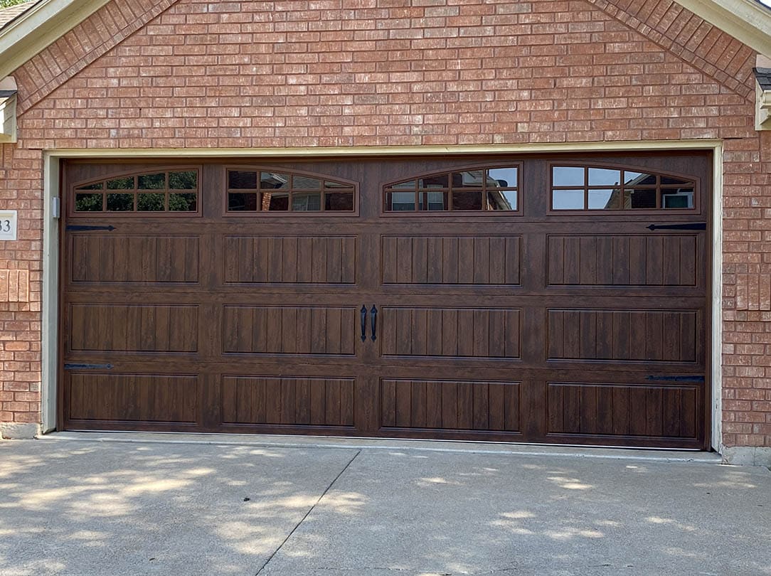 Photo of two garage with new cedar plank doors by Garage Door Rescue, LLC